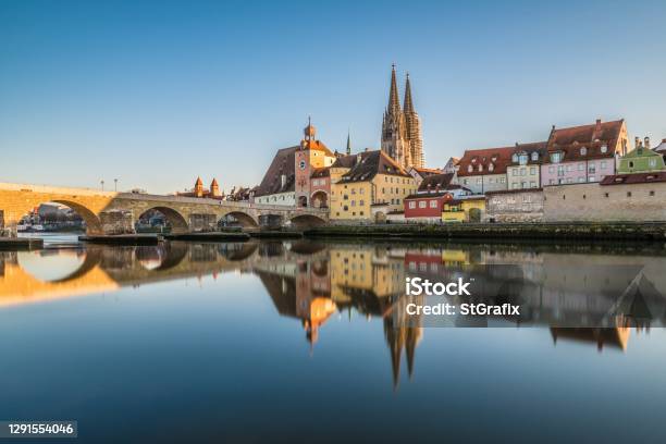 Famous City View Of Regensburg And Promenade With Stone Bridge The River Danube The Historical Old Town And The Cathedral St Peter Germany Stock Photo - Download Image Now
