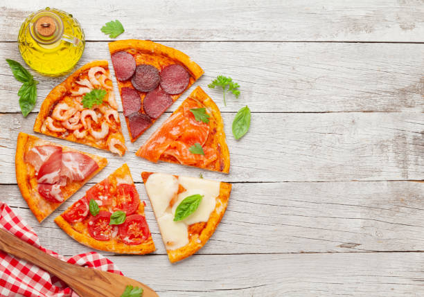 istock Tasty slices of different pizza 1291554257