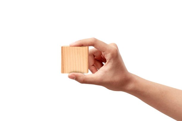 istock Hand holding wooden block toy 1291558477