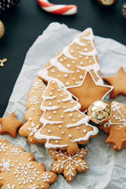 istock christmas flatley layout with cookies and a christmas tree. Composition with ginger cookies and cones on a dark background. 1291559368