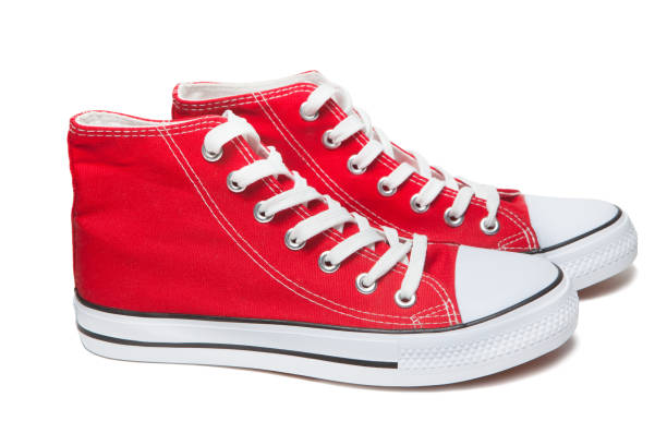 istock Red sport shoes isolated on white background 1291560555