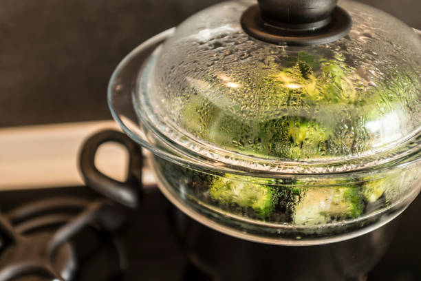 cooking vegetables in a steamer stock photo