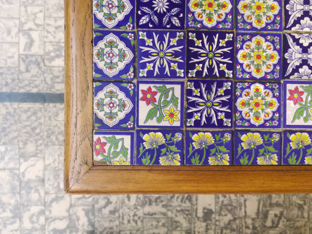 table with artistic colorful craft tiles