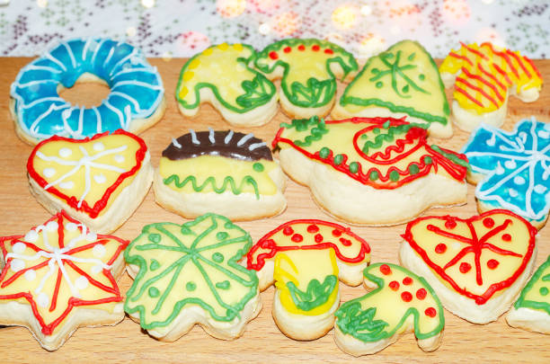 Homemade shaped cookies with icing on a cutting Board. Selective focus
