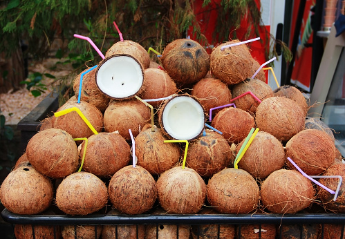 natural round coconut fruit in a brown shell
