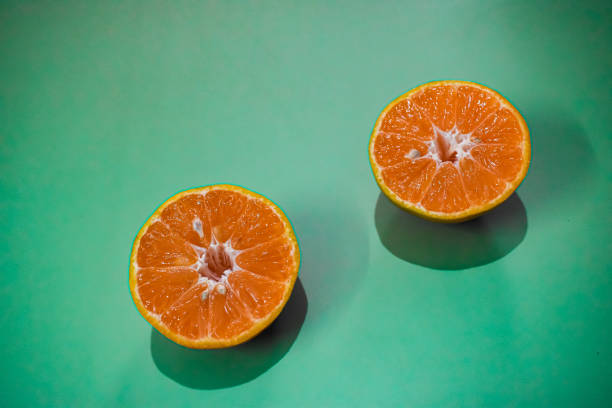 istock Orange pieces on green and yellow background 1291562307