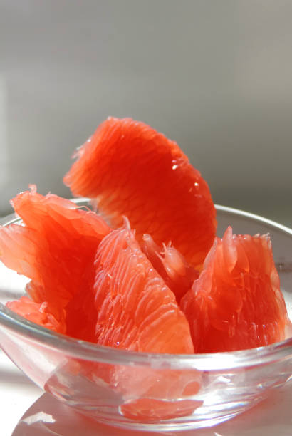 istock assorted citrus fruits grapefruit orange mandarin orange in a transparent bowl 1291564094