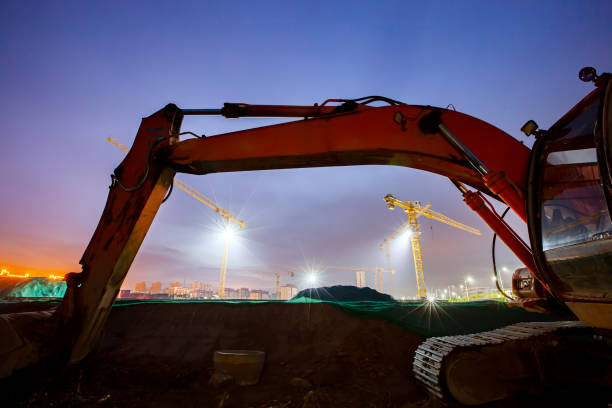 istock In the evening, excavators were at the construction site 1291569118