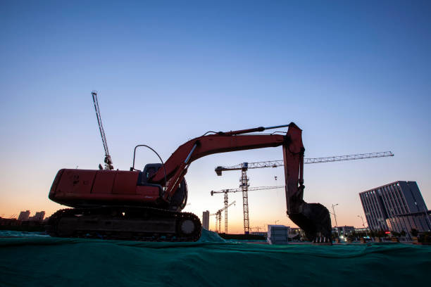 istock In the evening, excavators were at the construction site 1291569157