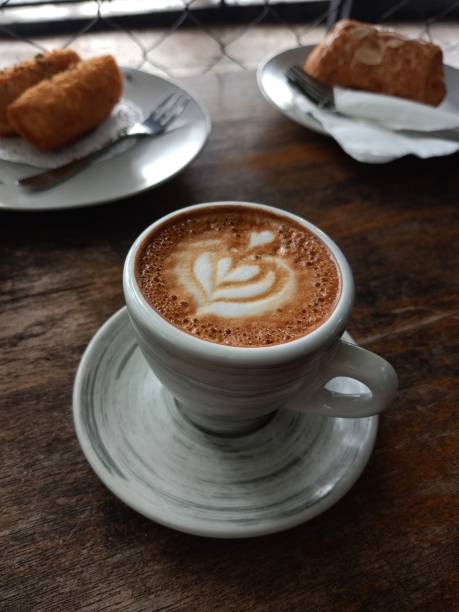 istock a glass of piccolo latte coffee with snacks 1291569212
