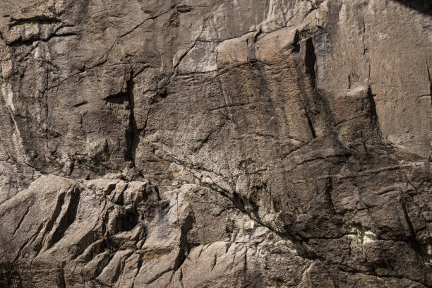 istock Background of stone wall texture rough rock surface 1291569612