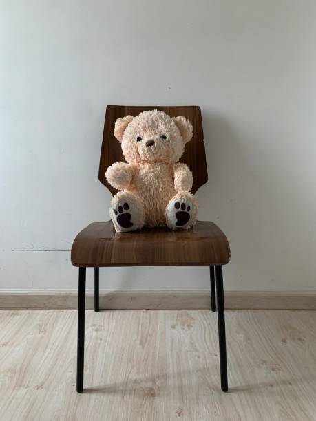 istock An image of teddy bear on the chair 1291572118