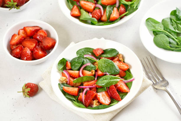 istock Healthy breakfast with fruit salad from strawberry, spinach and walnut 1291572966
