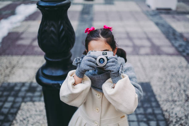 Girl outside taking photos for fun