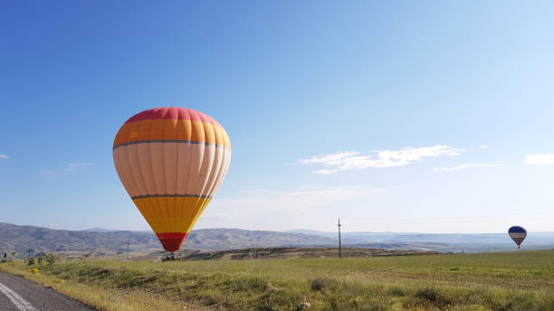 istock Hot air balloon and Cloudy sky at sunrise 1291575289