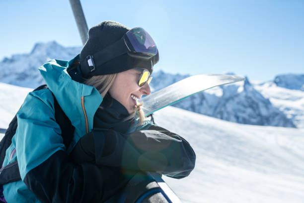 istock Smiling woman at ski resort 1291578264
