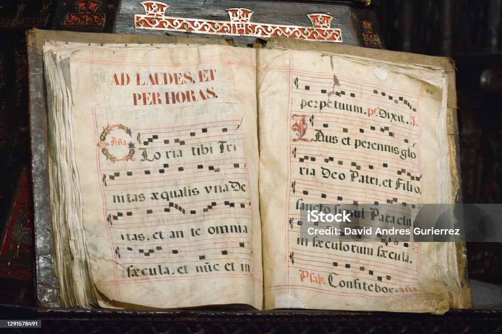 Ancient codex book written in Latin with musical score of Gregorian singing, Ad laudes, et per horas. At Astorga Cathedral, Spain Ancient codex book written in Latin with musical score of Gregorian chant, Ad laudes, et per horas. In the Cathedral of Astorga, Spain Manuscript Stock Photo