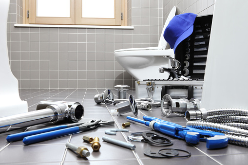 plumber tools and equipment in a bathroom, plumbing repair service, assemble and install concept