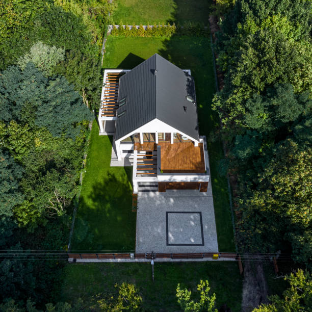 istock Drone view of house in forest 1291581353