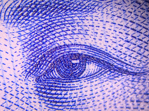 Banknote portrait human eye  Macrophotography background
