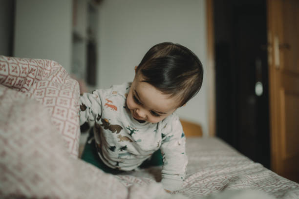 istock Cute Boy On Bed At Home 1291581859