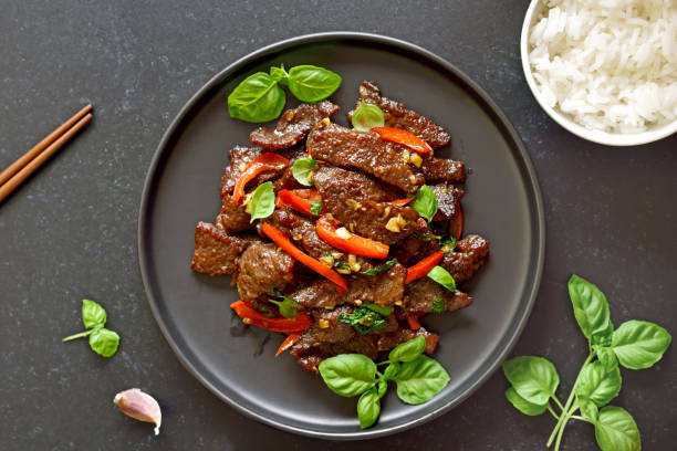 istock Thai beef stir-fry with pepper and basil 1291584413