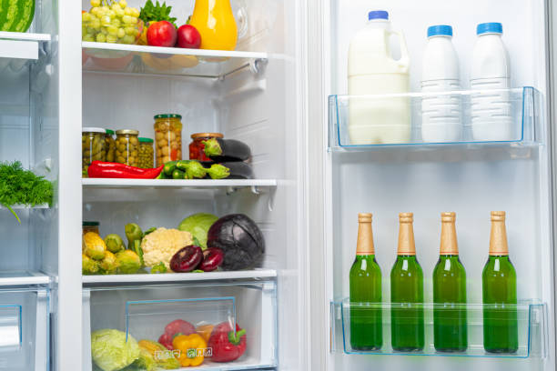 istock Open fridge full of fresh food and drinks 1291584452