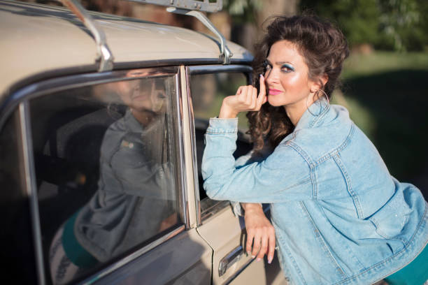 istock Funny young woman in a denim jacket 1291585565
