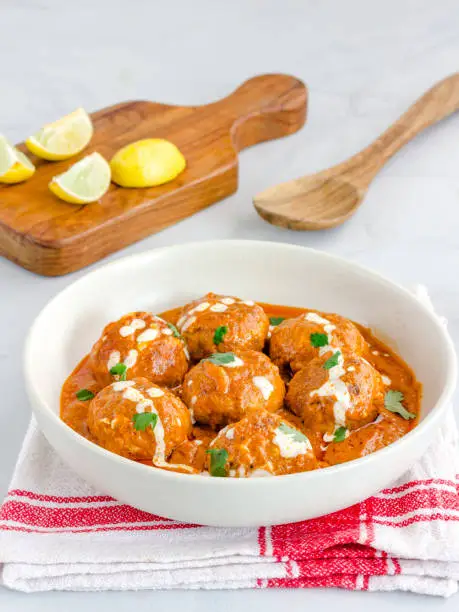 Butter Chicken Meatballs in a Bowl on White Background Flat Lay Top Down Photo, Indian Food Photography
