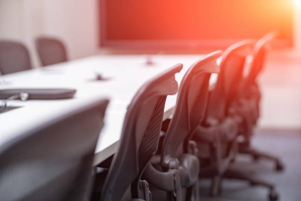 Close up table with equipment in conference room.