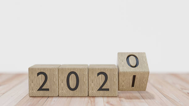 istock Wood blocks with the transition from year 2020 to 2021 on a white background. 3D rendering. 1291591431