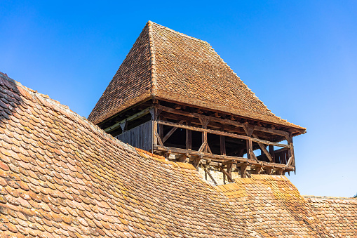 Architectural details of medieval church. View of fortified church of Viscri, UNESCO heritage site in Transylvania. Romania, 2021.