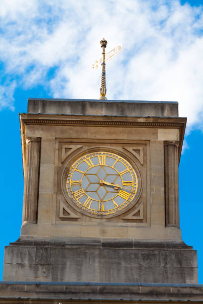 istock Golden colored clock in London 1291594707