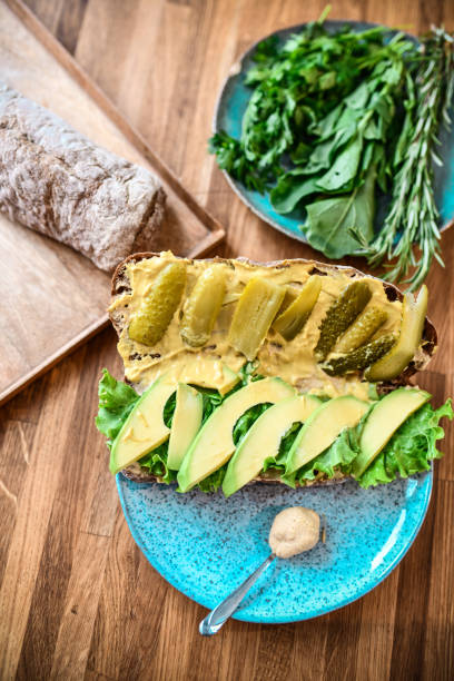istock Pickled Avocado Sandwich Ready For A Splash Of Mayonnaise 1291599123