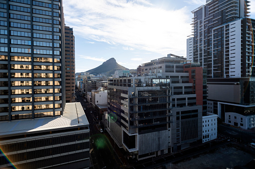Wide shot Lions Head mountain seen through downtown skyscrapers