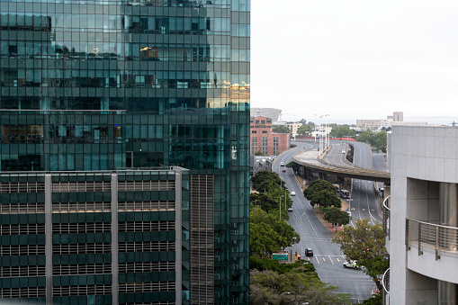 Elevated highway and modern glass office building