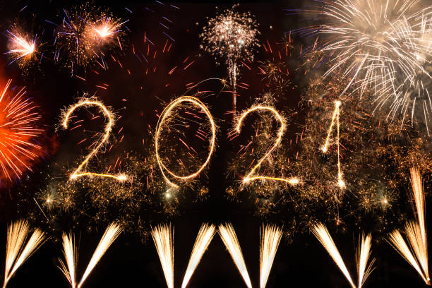 istock New year 2021 made with sparklers on black background 1291604432