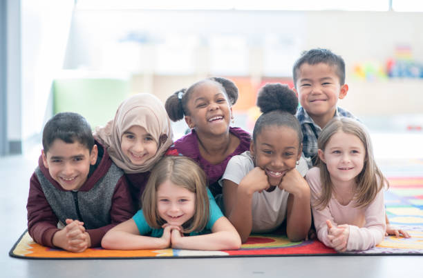 istock Multi ethnic preschool children smiling 1291604652