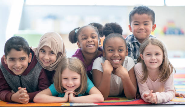 istock Multi ethnic preschool children smiling 1291604653