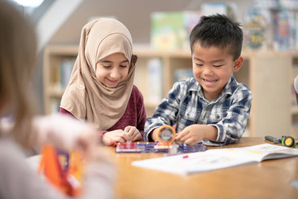 istock Toddlers doing crafts together at library 1291604670