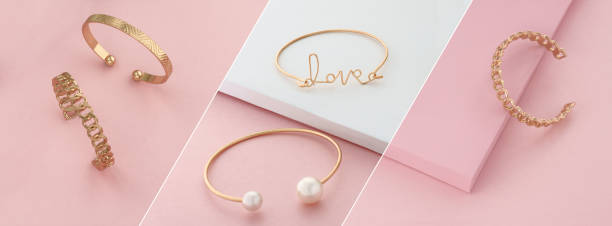 istock Modern golden bracelets on pink and white slanted layout 1291604913
