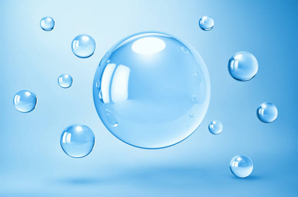 istock Abstract blue background with glass spheres 1291605719