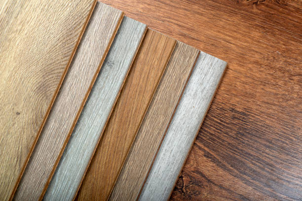 istock Laminate background. Samples of laminate or parquet with a pattern and wood texture for flooring and interior design. Production of wooden floors 1291605770
