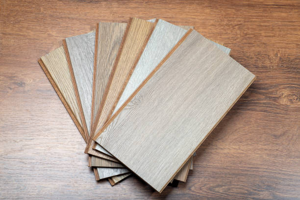 istock Laminate background. Samples of laminate or parquet with a pattern and wood texture for flooring and interior design. Production of wooden floors 1291605792