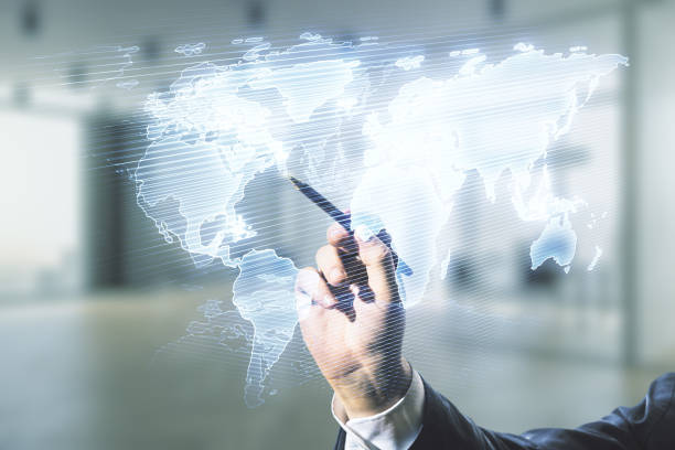istock Multi exposure of man hand with pen working with abstract graphic world map on blurred office background, connection and communication concept 1291606244