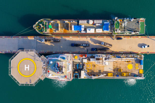 istock Offshore supply Ship docked next to a general Cargo vessel. 1291606429