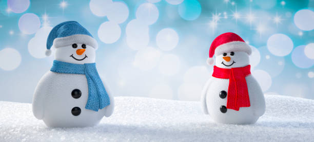istock Two happy Snowman on the snow 1291606606