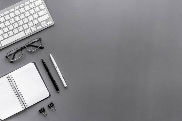 istock Workplace flat lay with computer and office supplies top view 1291607386