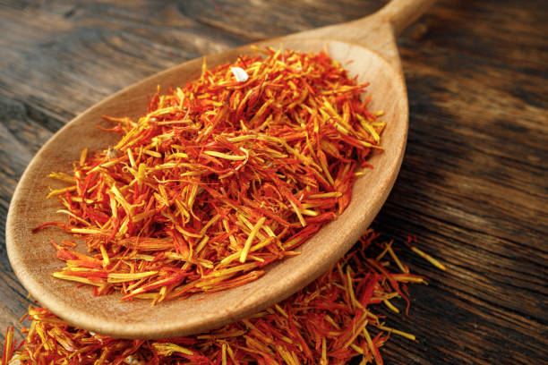 istock Saffron spice on wooden table macro photo 1291607538