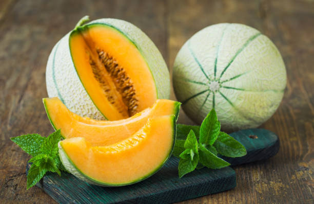 istock Fresh ripe melons on the wooden table 1291607540